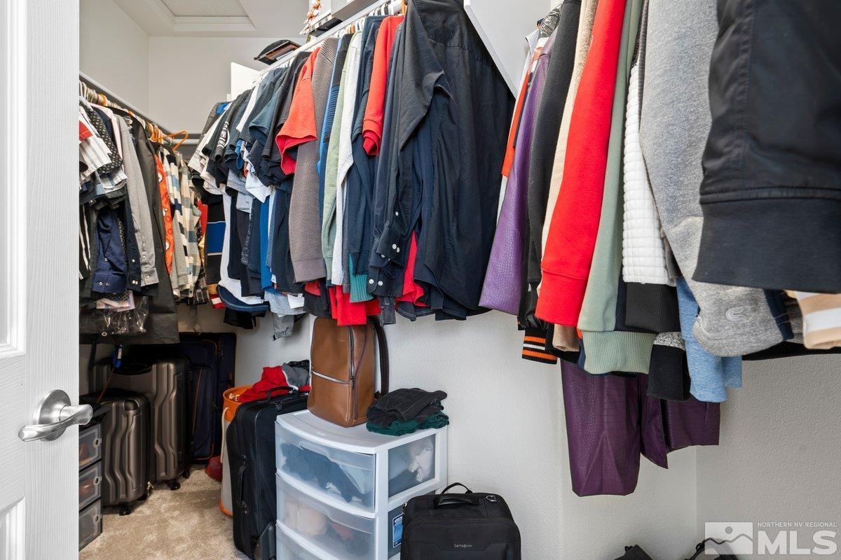 11022 Colton Drive Reno, NV 89521 - Photo 17 of 26 a view of walk in closet with clothes