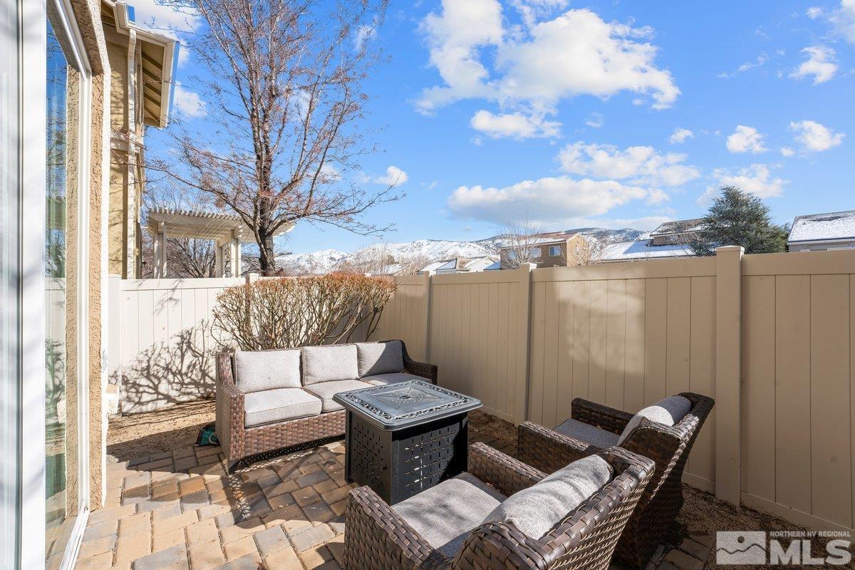 11022 Colton Drive Reno, NV 89521 - Photo 22 of 26 a view of a terrace with furniture and a city view