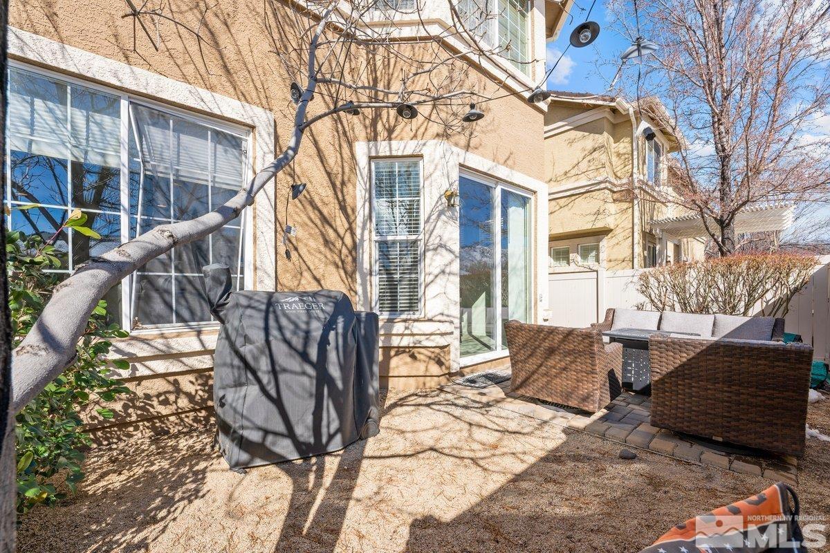 11022 Colton Drive Reno, NV 89521 - Photo 25 of 26 a view of a house with backyard and trees