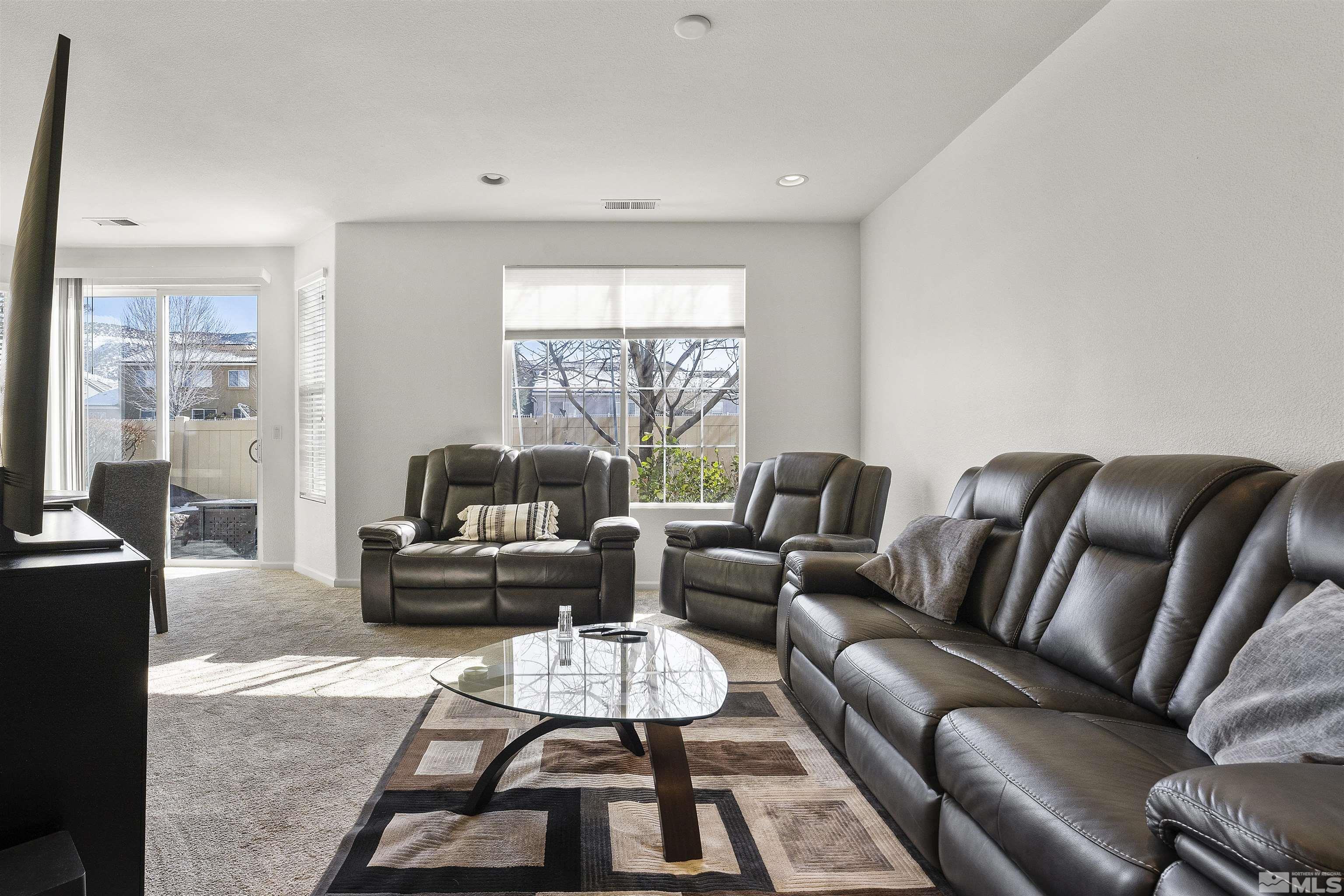 11022 Colton Drive Reno, NV 89521 - Photo 4 of 26 a living room with furniture and a large window