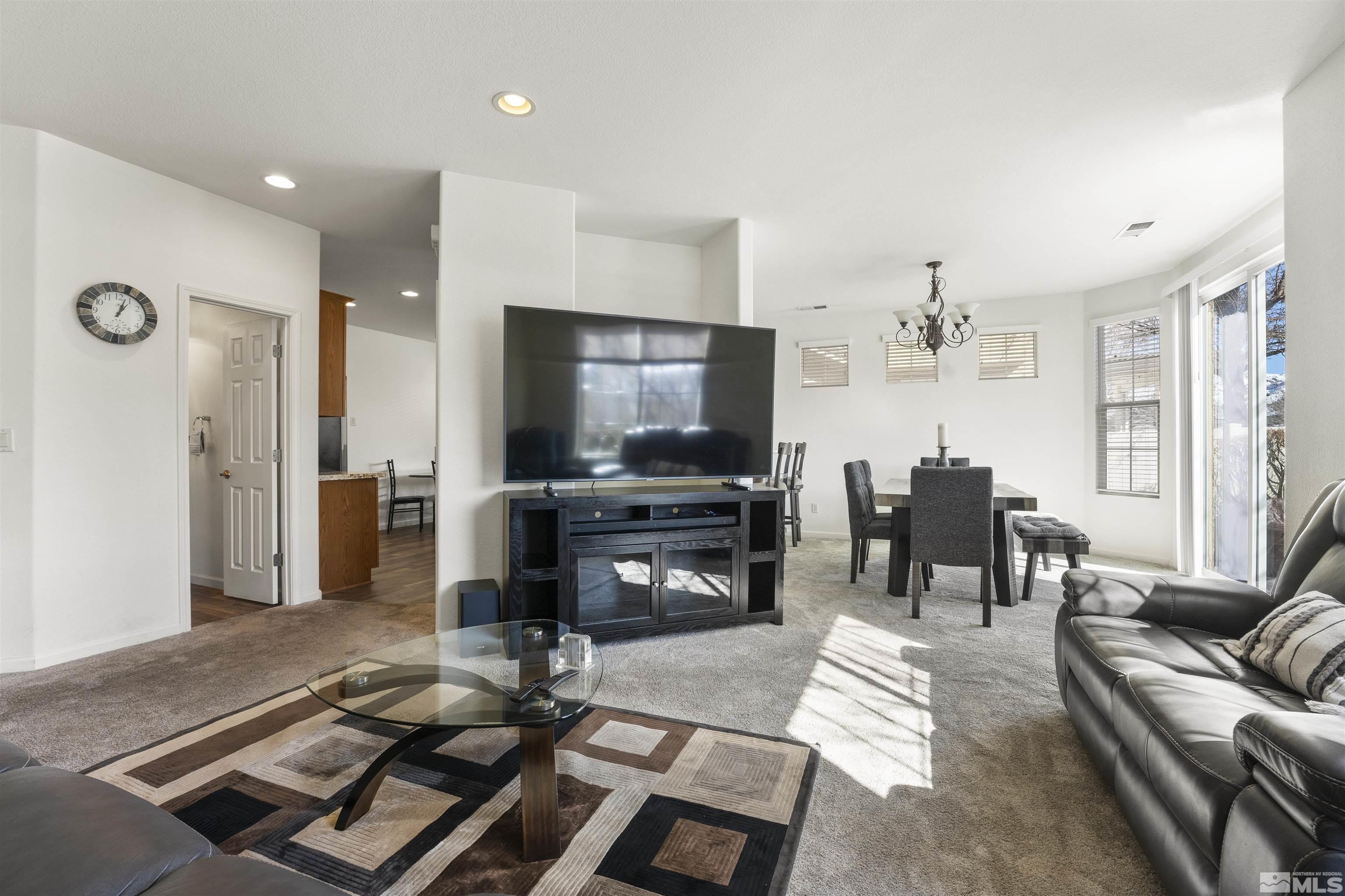 11022 Colton Drive Reno, NV 89521 - Photo 6 of 26 a living room with furniture and a flat screen tv