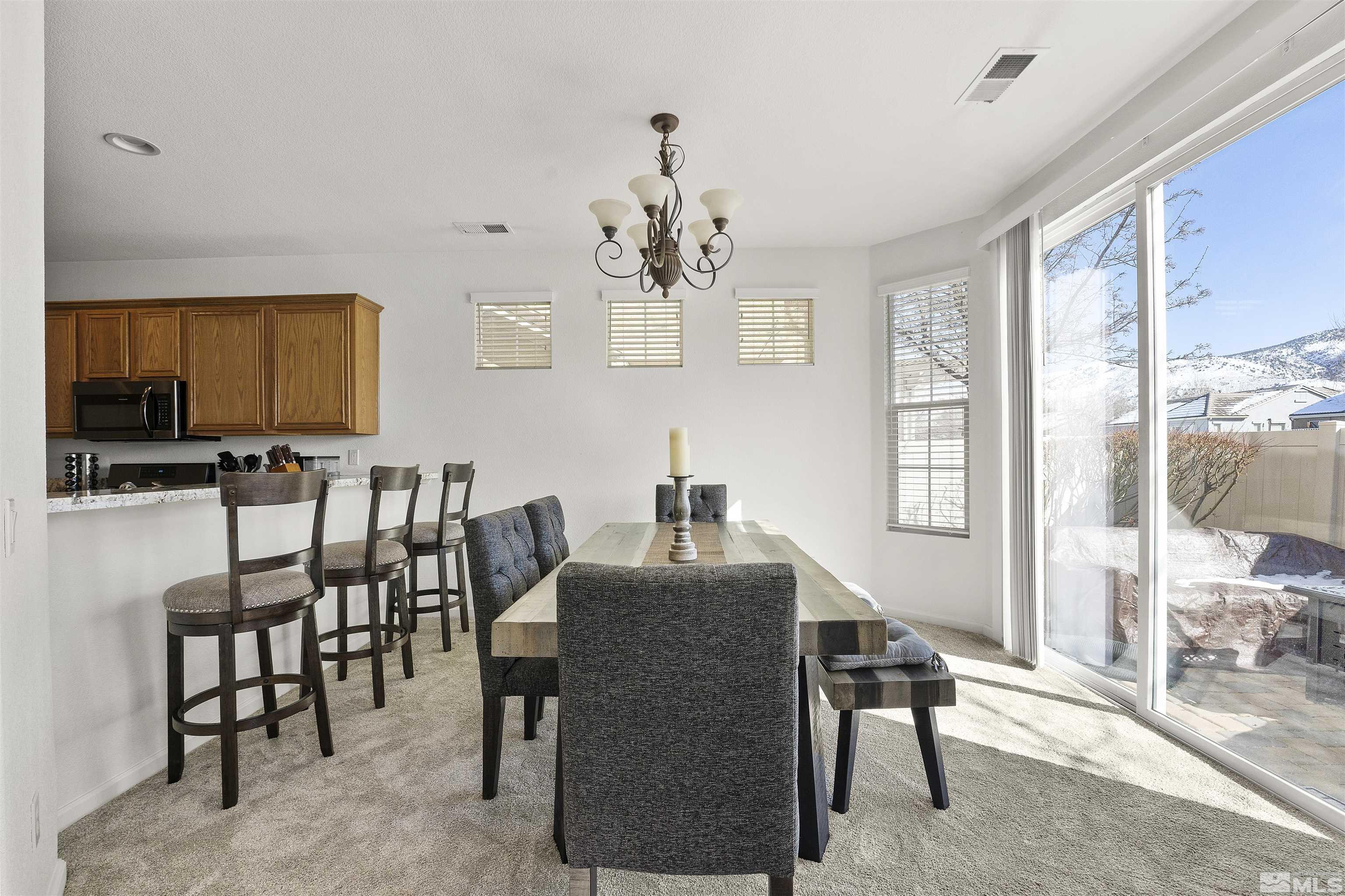 11022 Colton Drive Reno, NV 89521 - Photo 7 of 26 a dining room with furniture and window