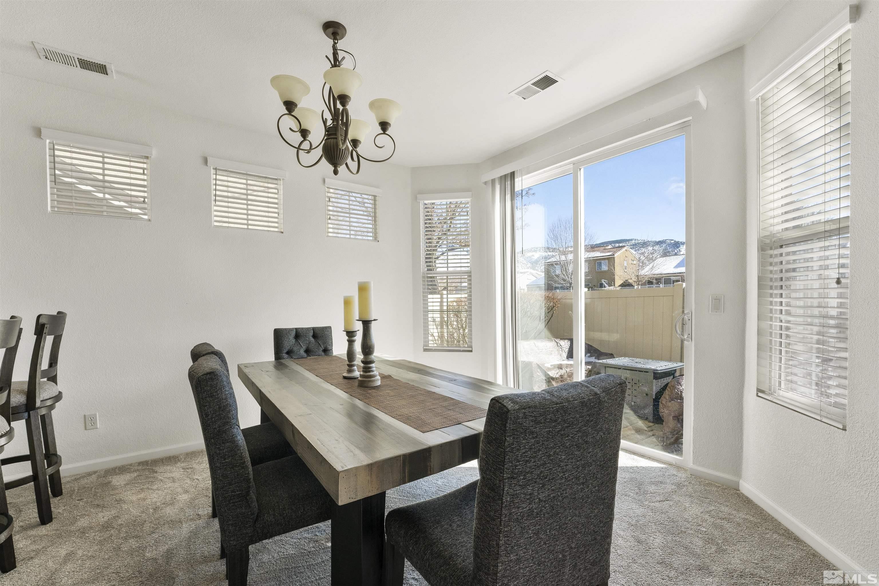 11022 Colton Drive Reno, NV 89521 - Photo 8 of 26 a view of a dining room with furniture window and outside view