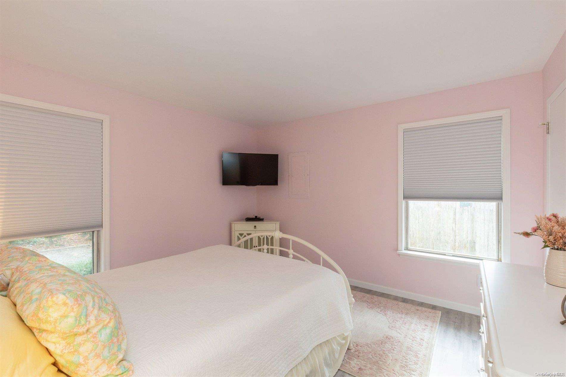 37 Halsey Road Remsenburg, NY 11960 - Photo 12 of 17 a bedroom with a bed and a tv