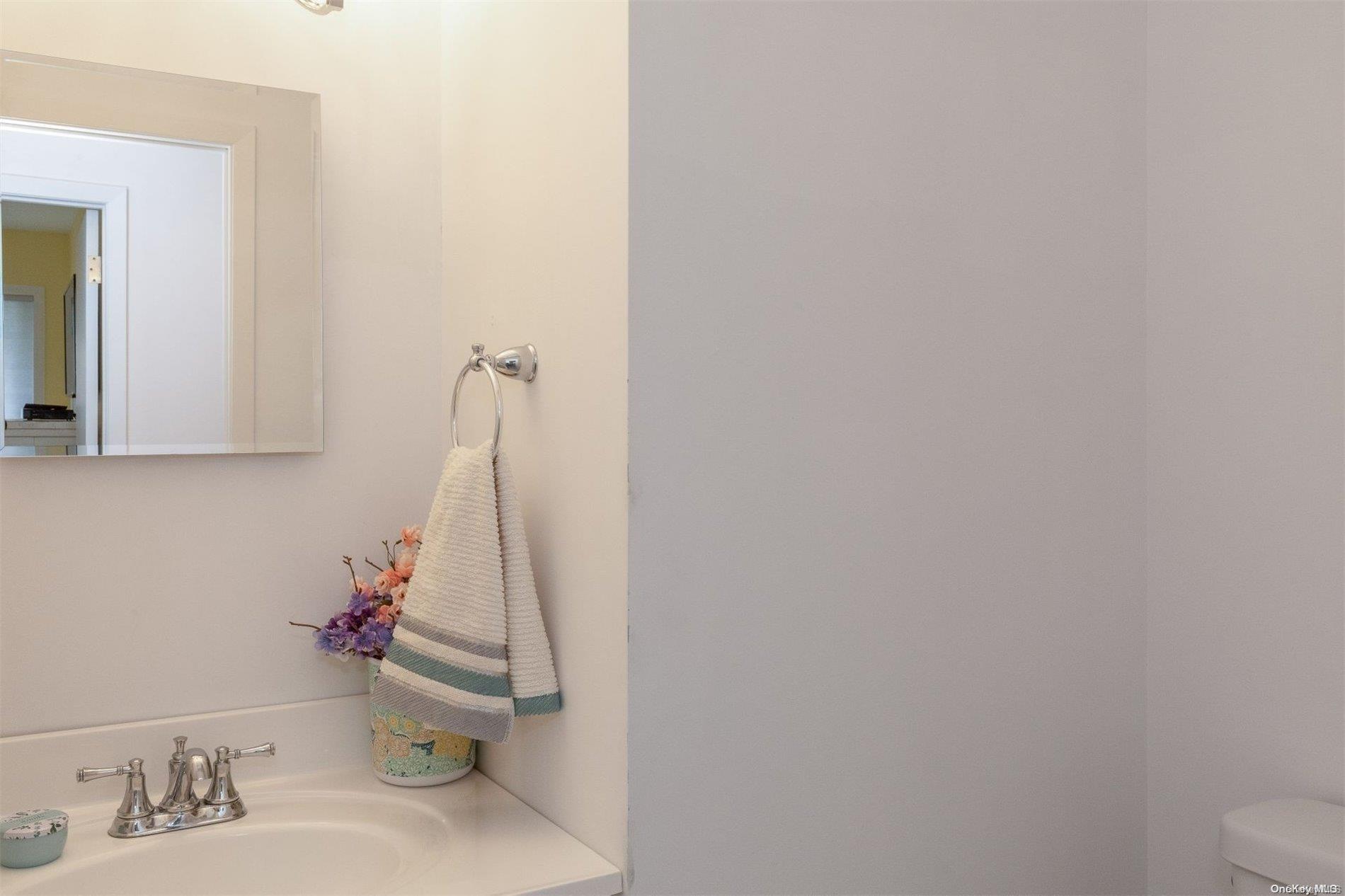 37 Halsey Road Remsenburg, NY 11960 - Photo 15 of 17 a bathroom with a sink and a toilet