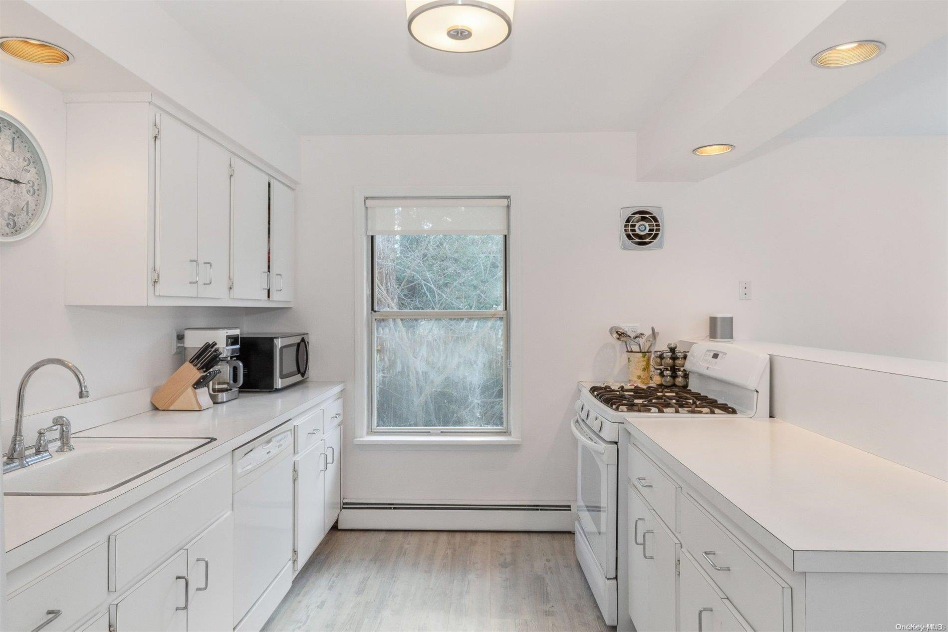 37 Halsey Road Remsenburg, NY 11960 - Photo 8 of 17 a kitchen with a sink cabinets and window