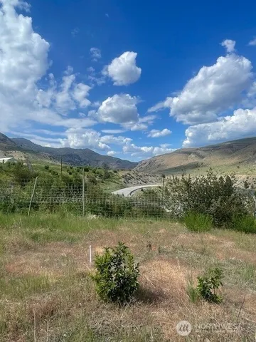 a view of a lake with a yard