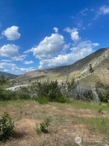 a view of a lake with a yard