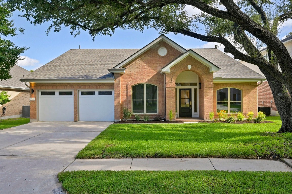 8902 Rustic Cove Austin, TX 78717 - Photo 1 of 1 a front view of a house with a yard
