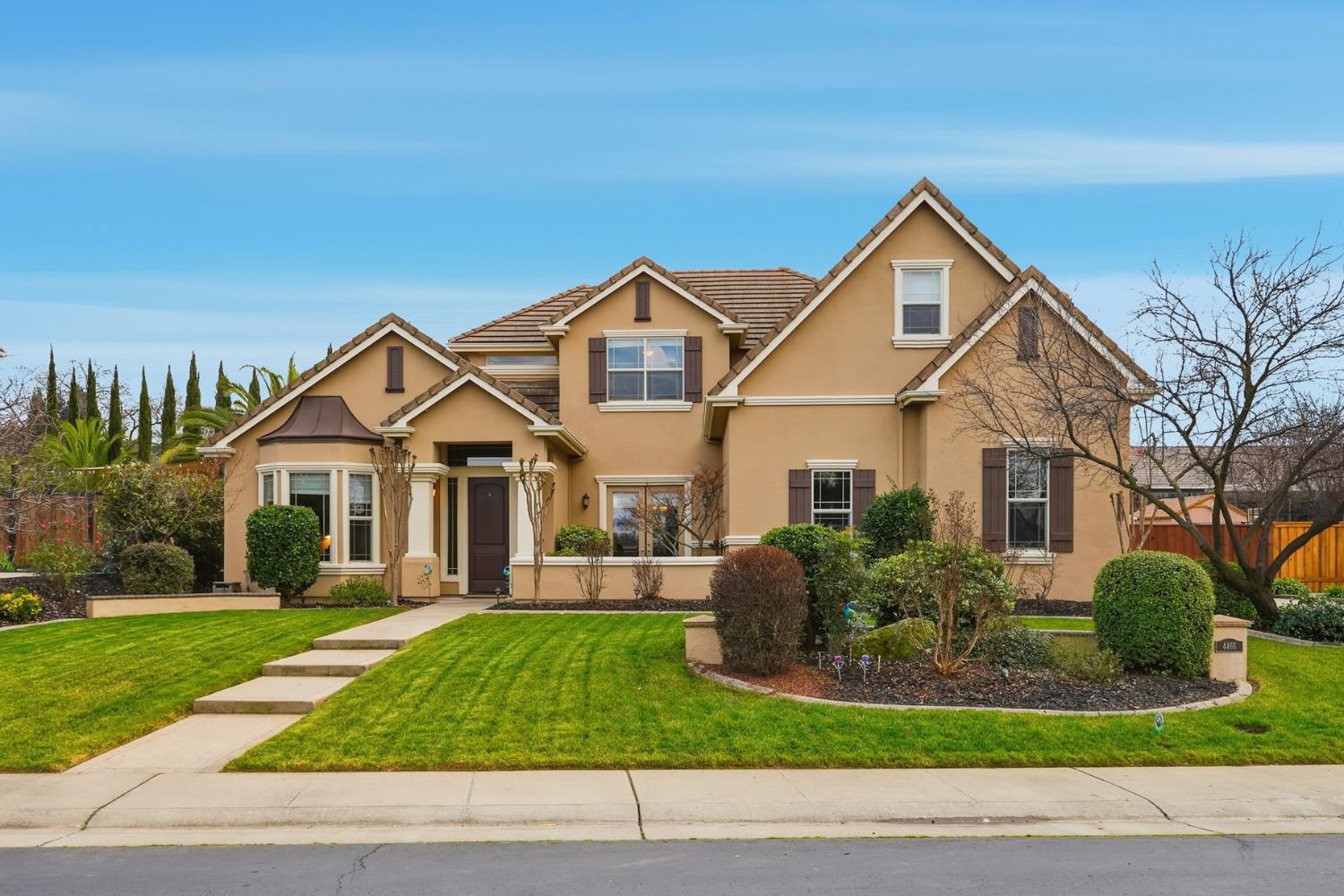 a front view of a house with a yard