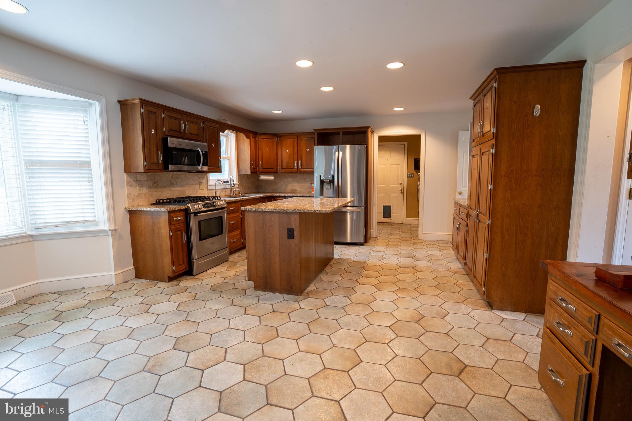 223 Buckfield Drive Lititz, PA 17543 - Photo 4 of 14 a kitchen with stainless steel appliances granite countertop a refrigerator a sink a stove top oven and a refrigerator