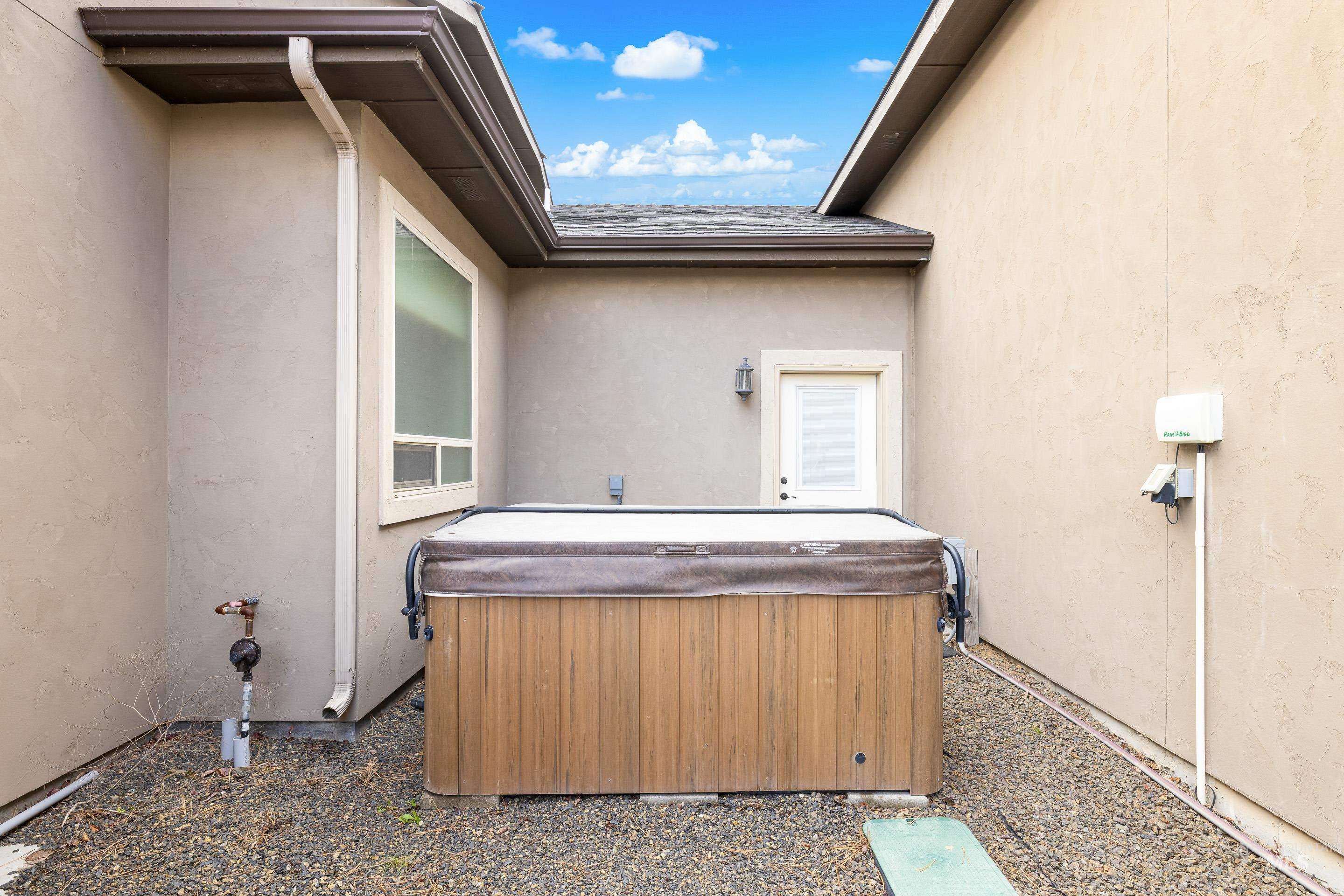 7521 North Grand Ridge Lane Eagle, ID 83616 - Photo 42 of 50 View of patio featuring a hot tub