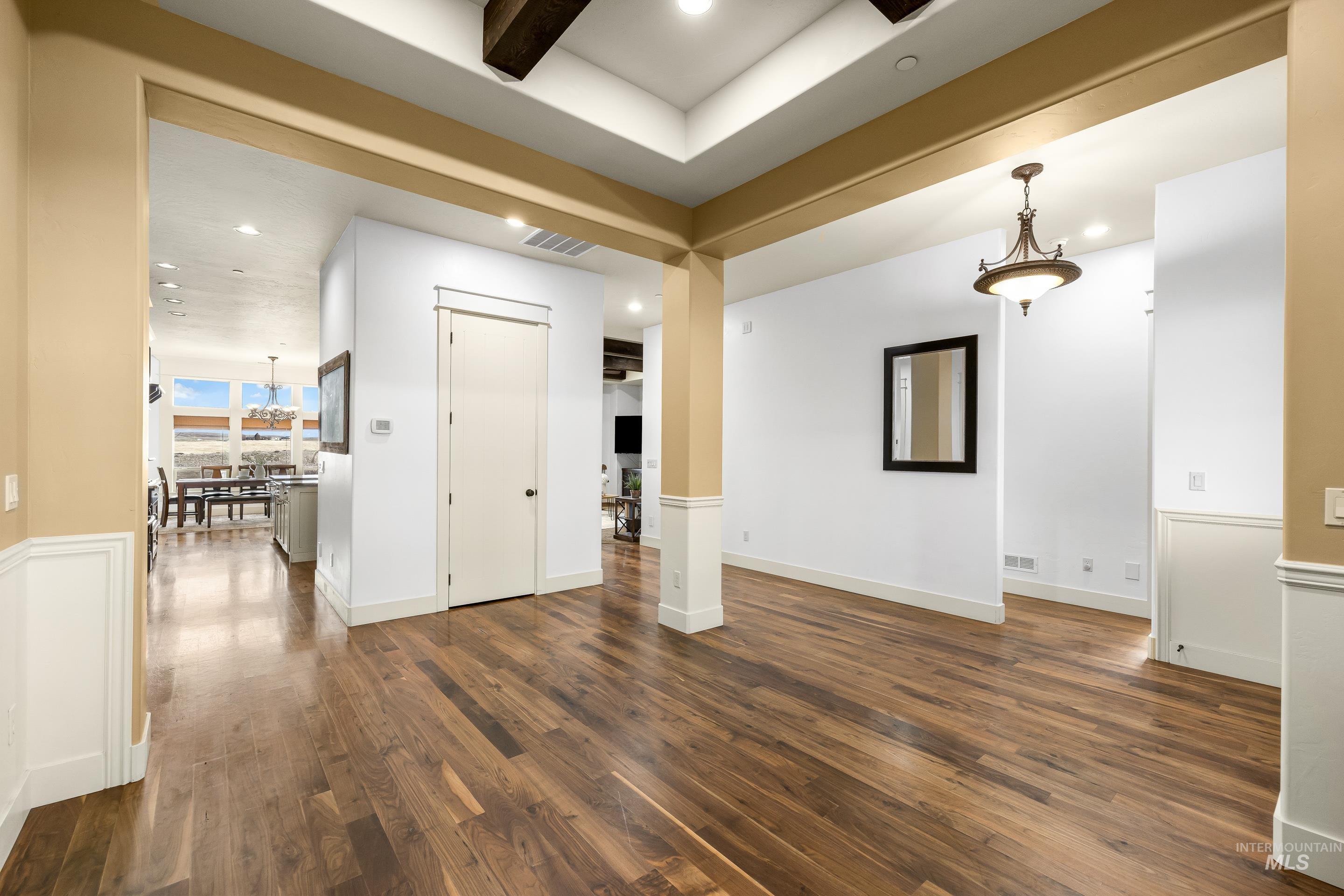 7521 North Grand Ridge Lane Eagle, ID 83616 - Photo 7 of 50 Unfurnished room with dark wood-style floors and recessed lighting