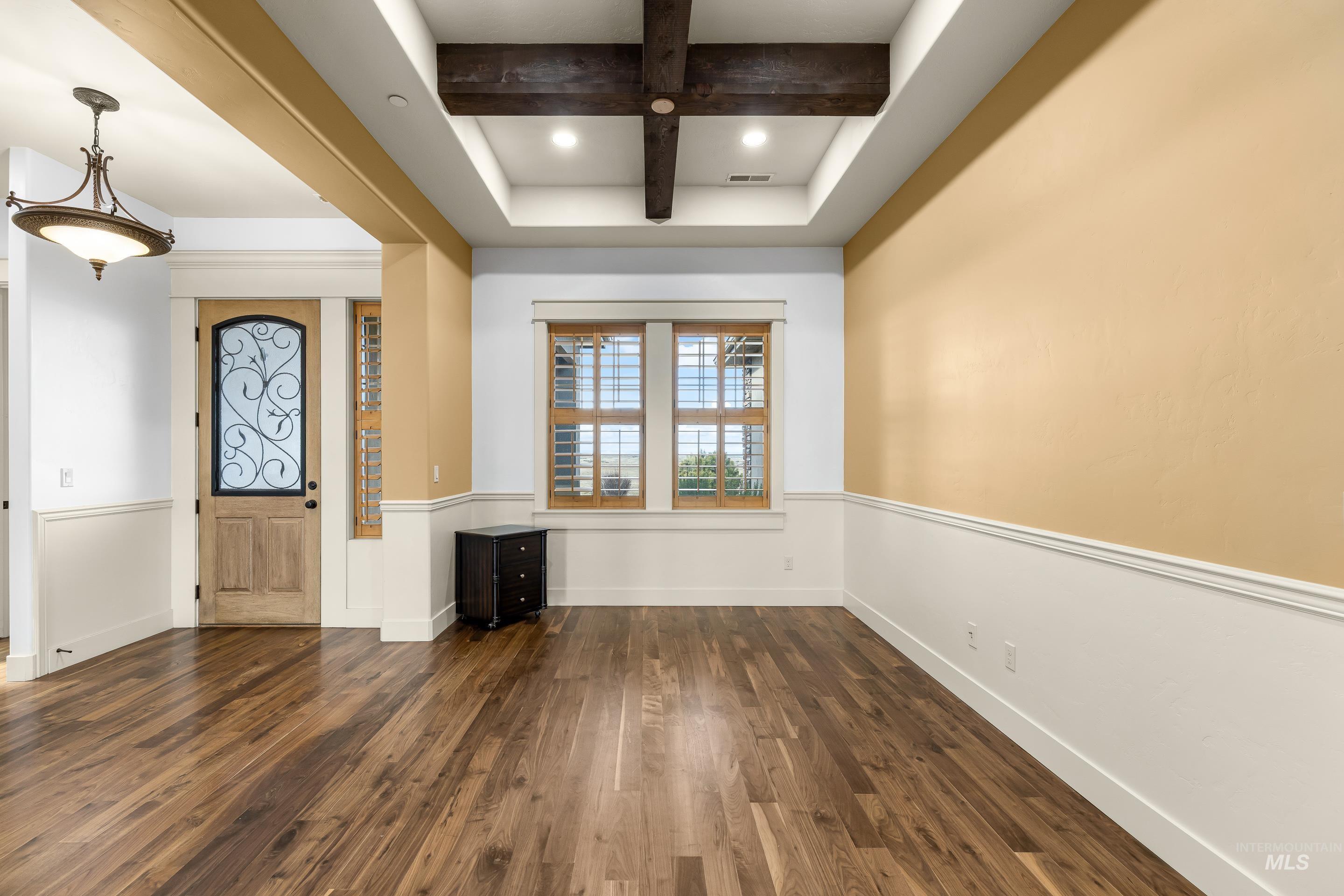 7521 North Grand Ridge Lane Eagle, ID 83616 - Photo 9 of 50 Entrance foyer with coffered ceiling, dark wood-style flooring, and recessed lighting