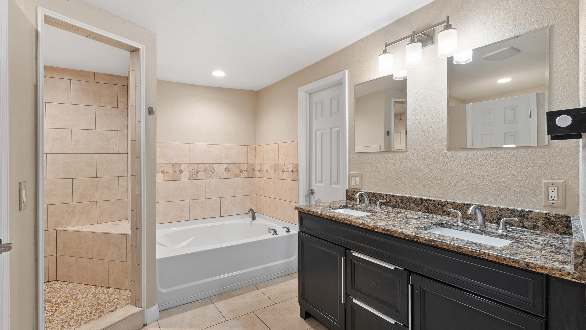 2936 Shepard Drive Rockledge, FL 32955 - Photo 13 of 25 a bathroom with a granite countertop sink mirror and bathtub