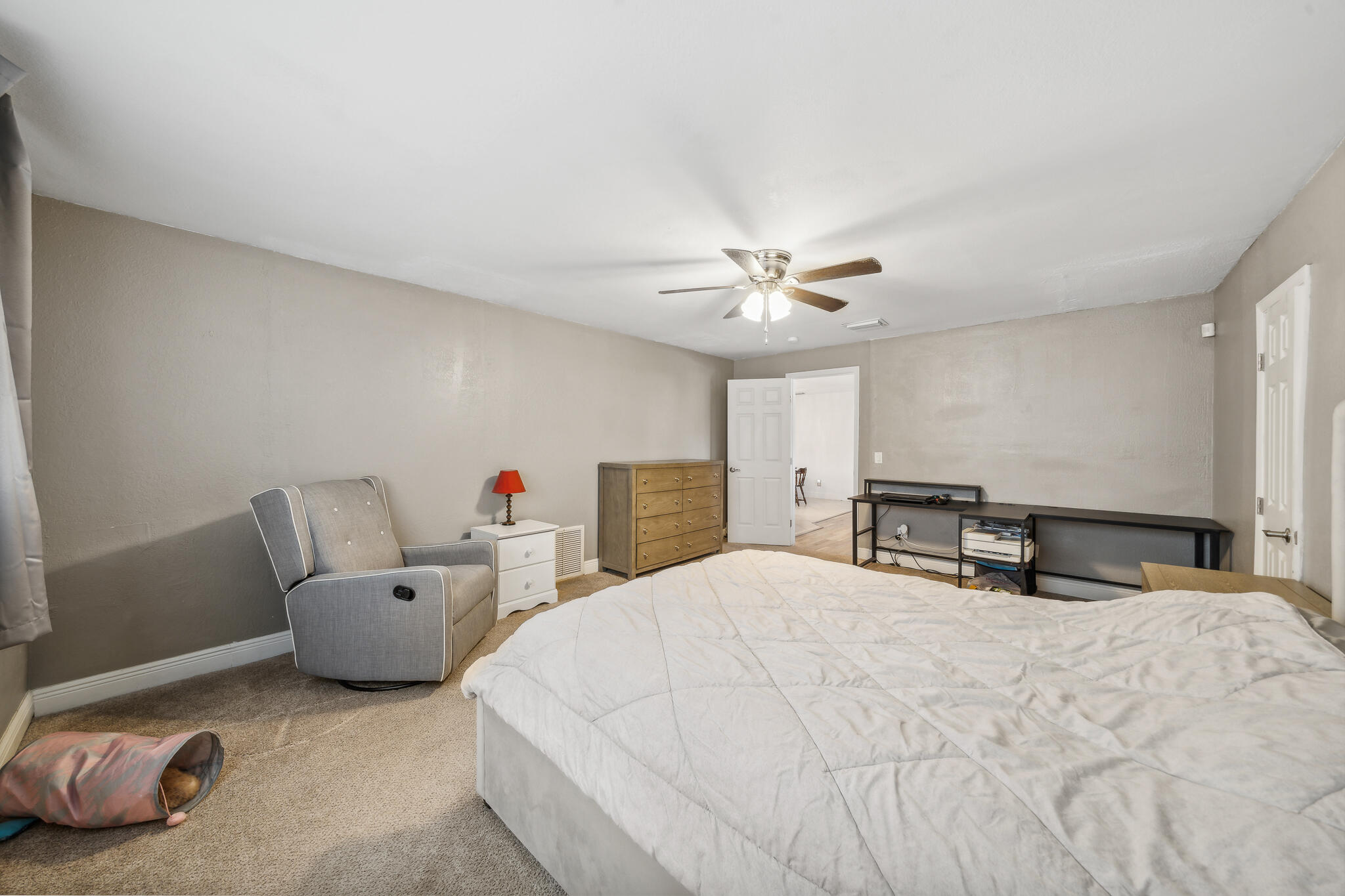2936 Shepard Drive Rockledge, FL 32955 - Photo 14 of 25 a bedroom with a bed and a chandelier
