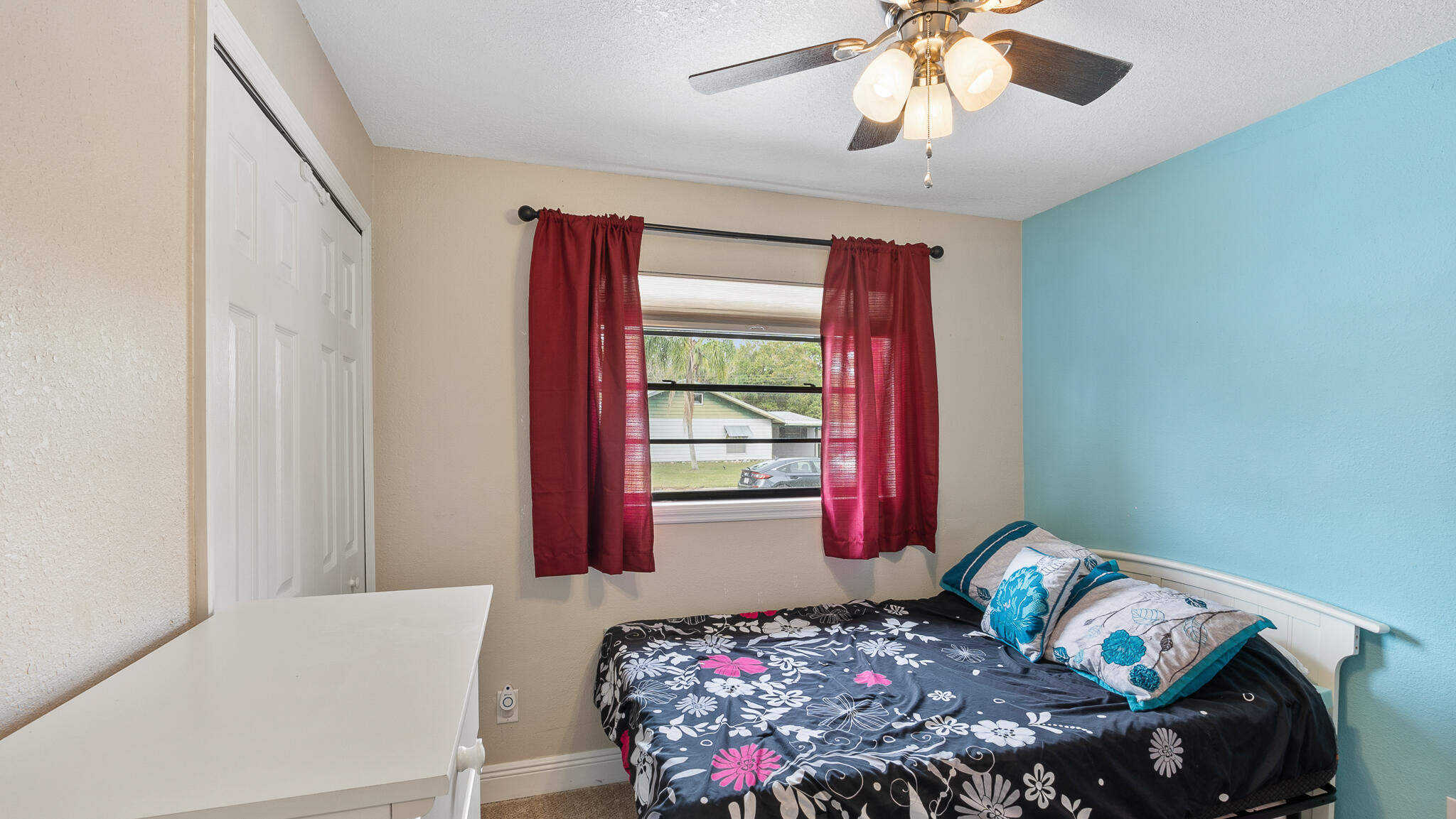 2936 Shepard Drive Rockledge, FL 32955 - Photo 17 of 25 a bedroom with a bed and a chandelier