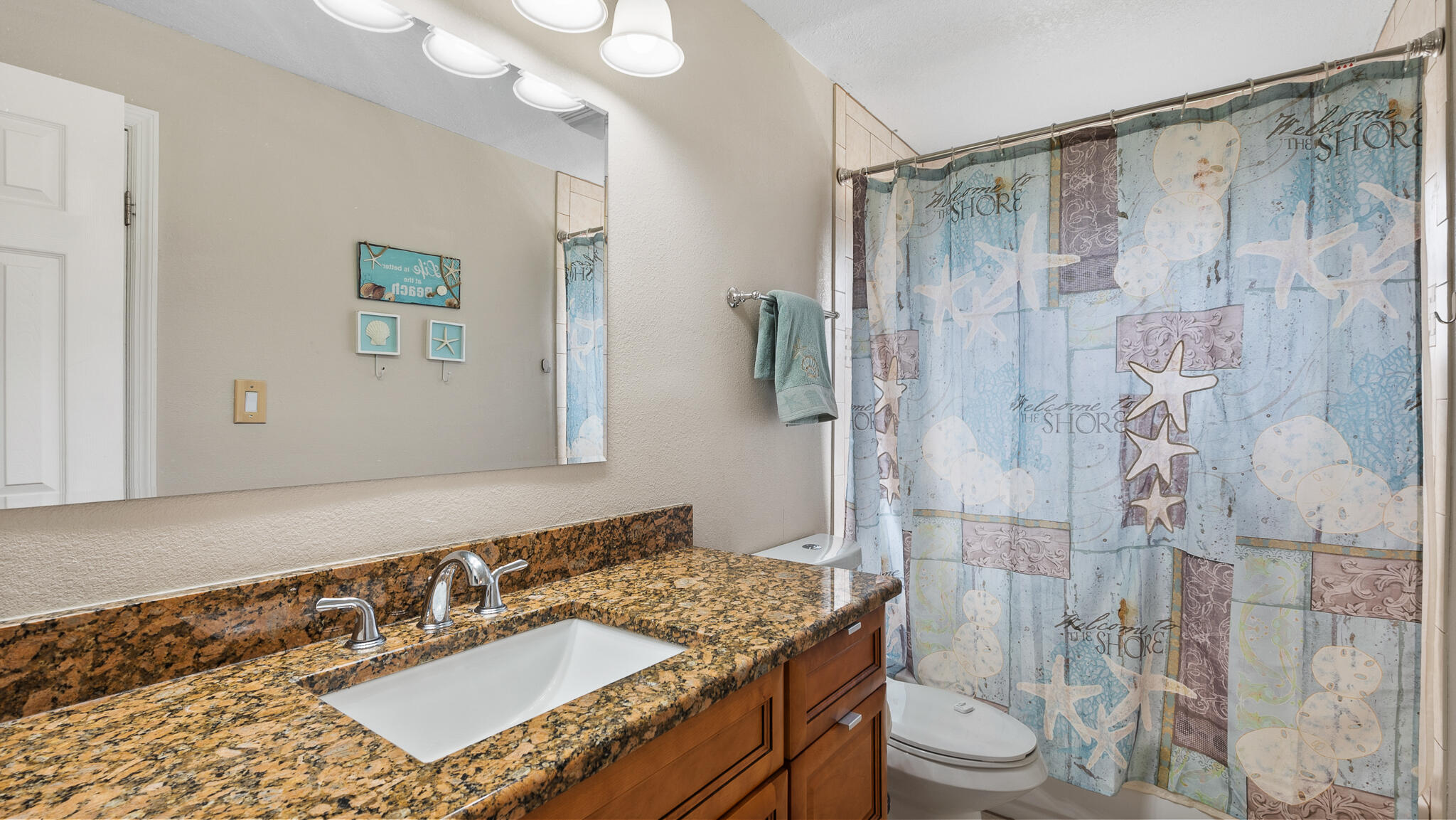 2936 Shepard Drive Rockledge, FL 32955 - Photo 19 of 25 a bathroom with a sink toilet and shower