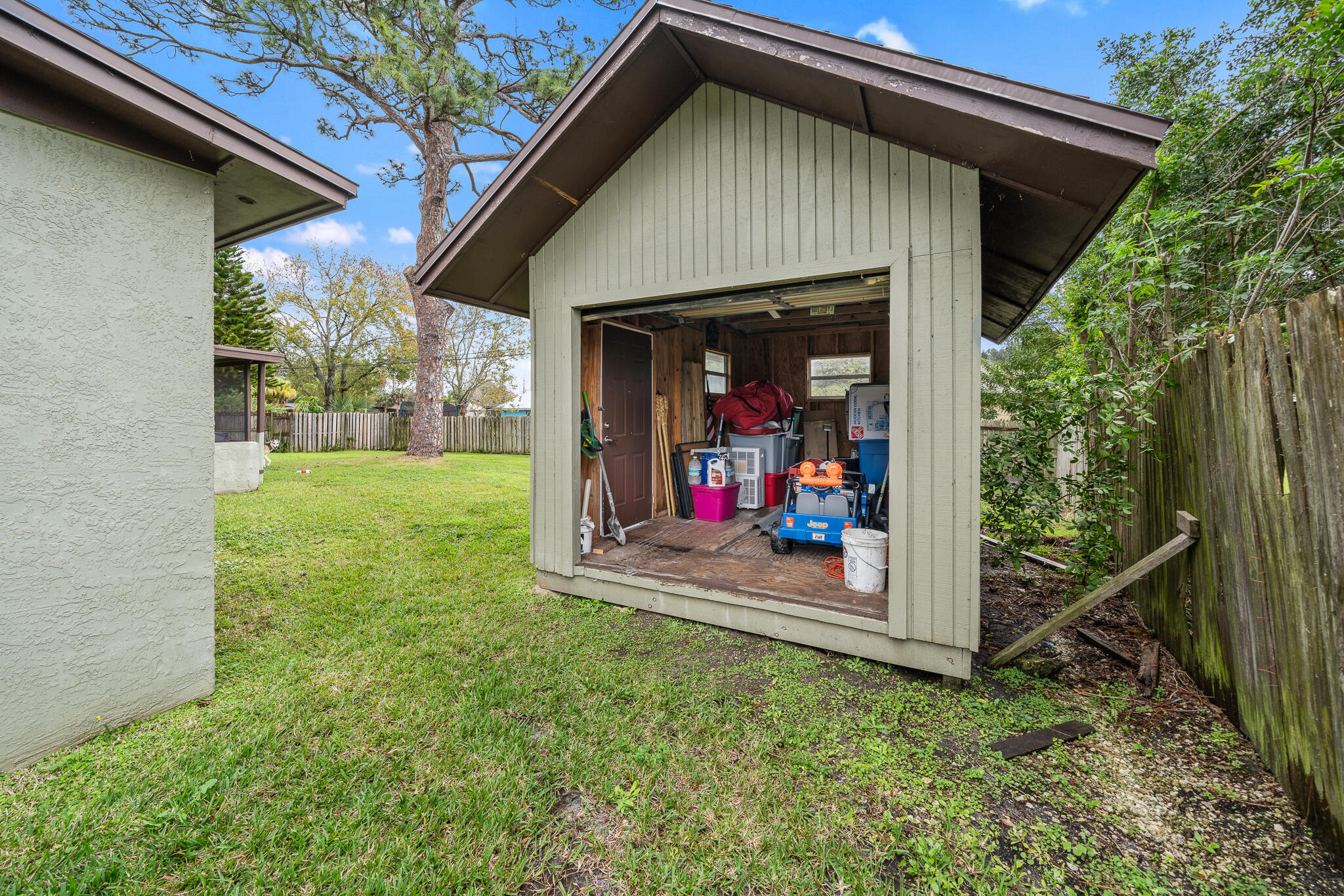 2936 Shepard Drive Rockledge, FL 32955 - Photo 23 of 25 a view of a wooden house with a small yard