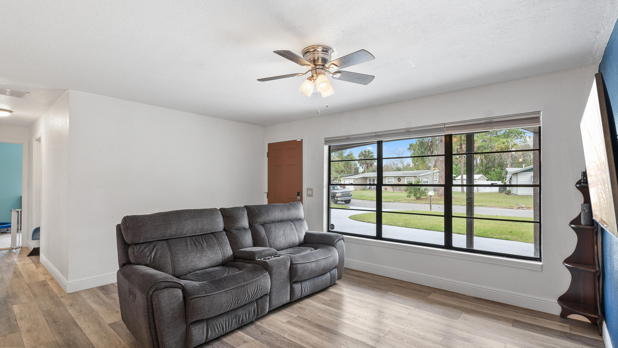 2936 Shepard Drive Rockledge, FL 32955 - Photo 3 of 25 a living room with furniture and a large window with wooden floor