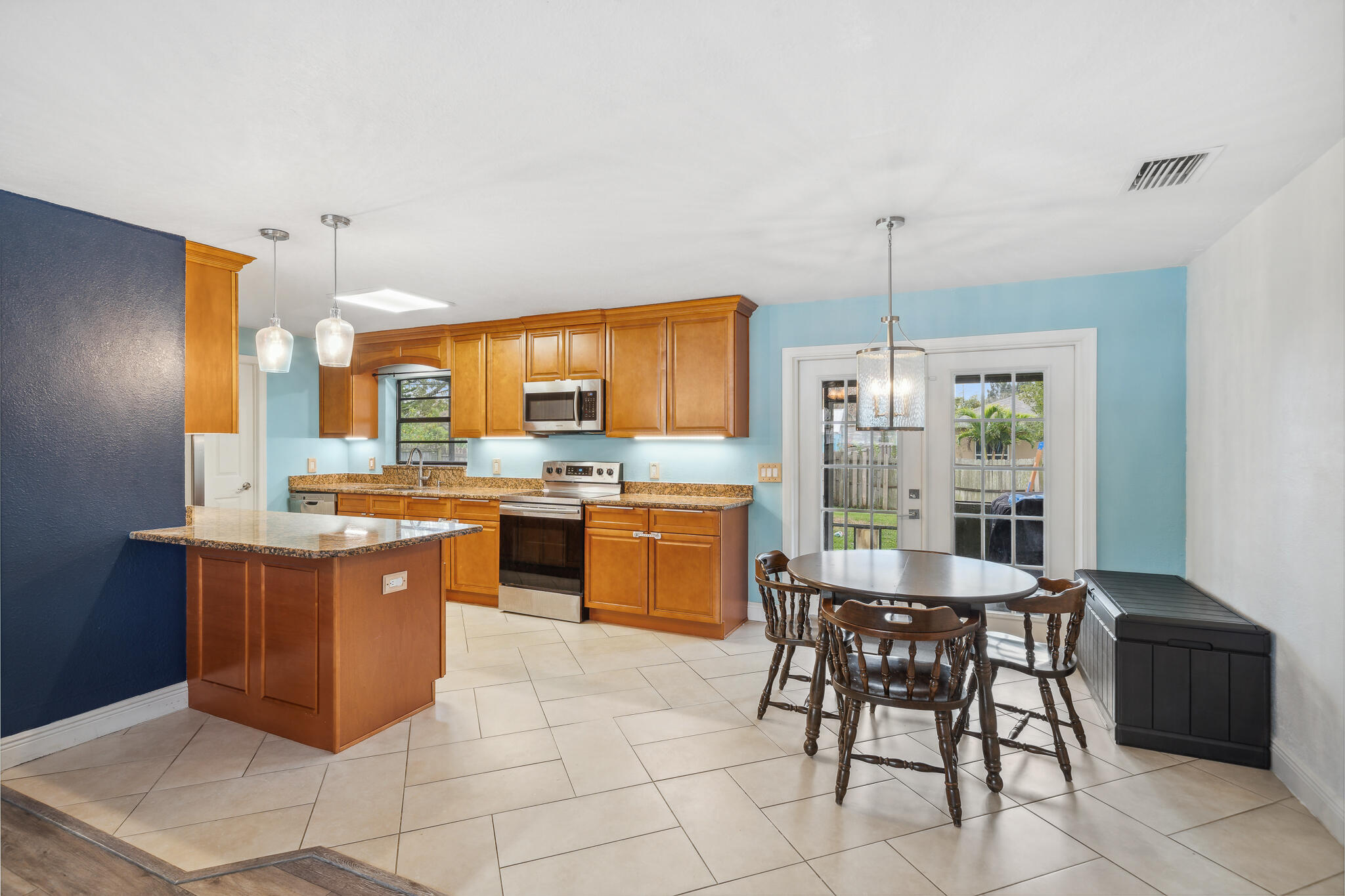 2936 Shepard Drive Rockledge, FL 32955 - Photo 6 of 25 a kitchen with a sink a counter top space appliances and cabinets