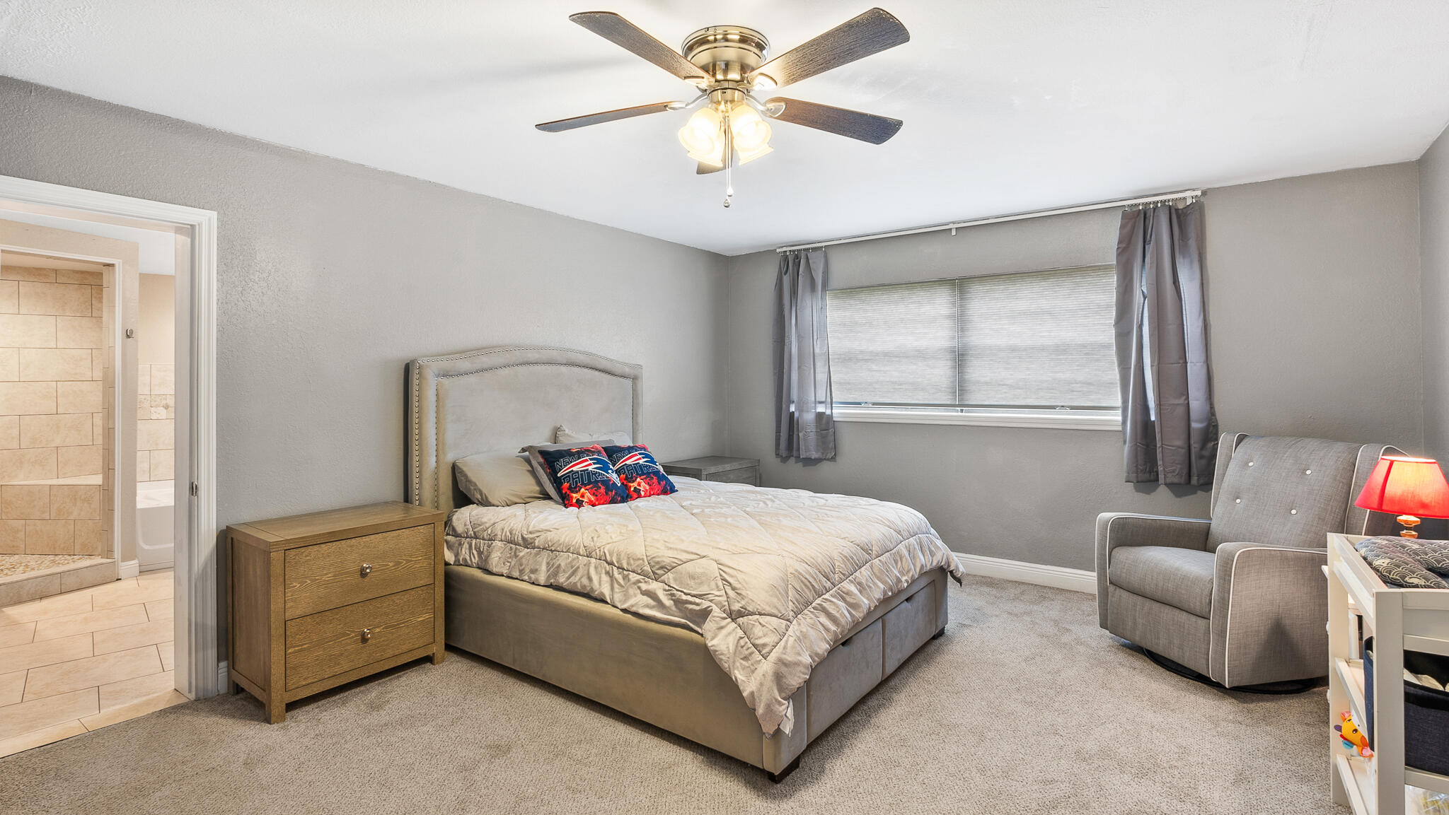 2936 Shepard Drive Rockledge, FL 32955 - Photo 10 of 25 a bedroom with a bed and a chandelier