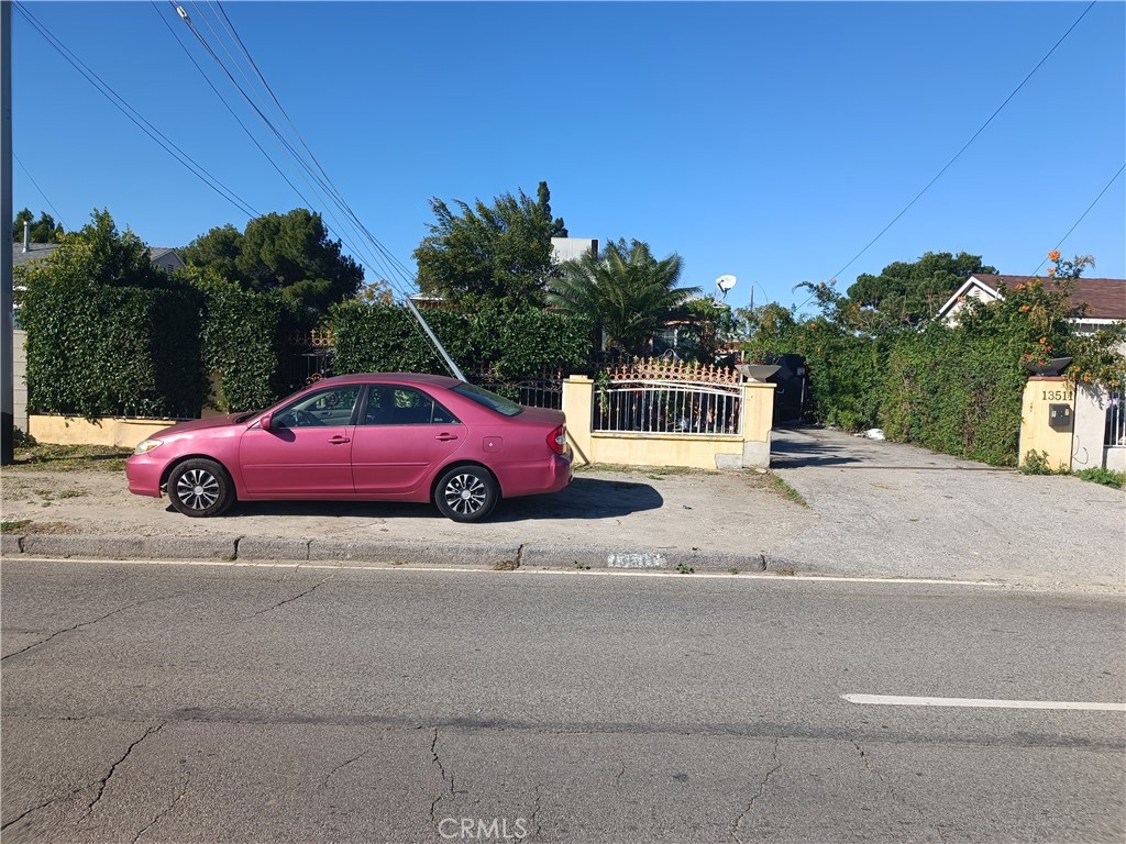 a red car parked on the side of the road