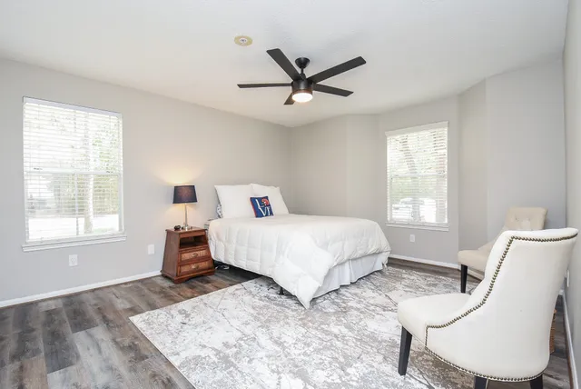 a bedroom with a bed and window