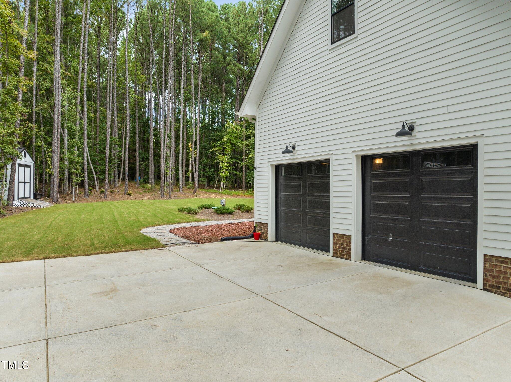 6118 Sibling Pine Drive Durham, NC 27705 - Photo 39 of 40 side garage