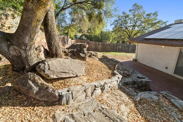 a view of backyard of a house
