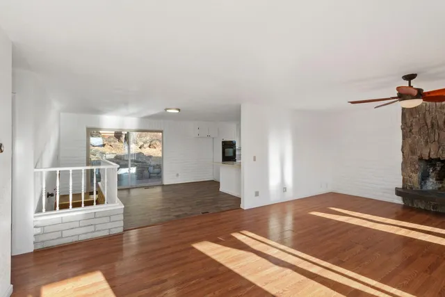 a view of livingroom with hardwood floor and a ceiling fan