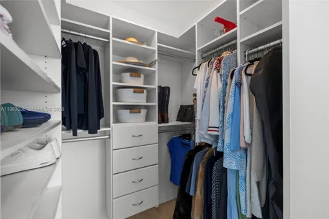 a bedroom with a bed and a table