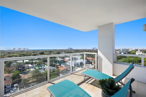 a view of a balcony with chair and table