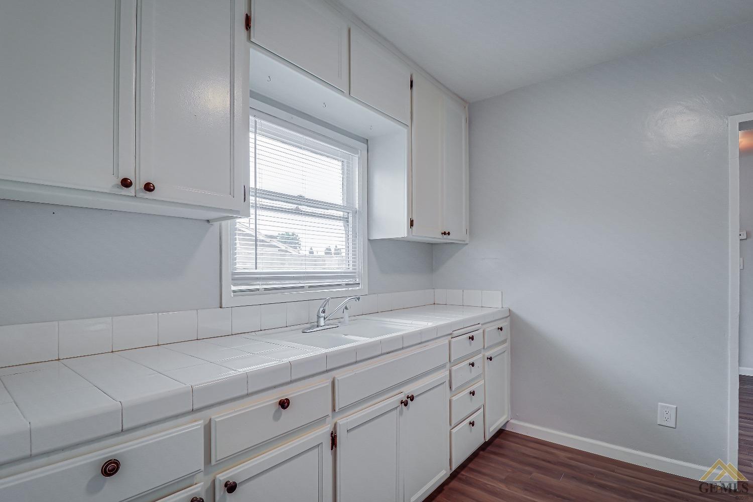 Undisclosed Address Bakersfield, CA 93308 - Photo 15 of 24 a view with cabinets and window