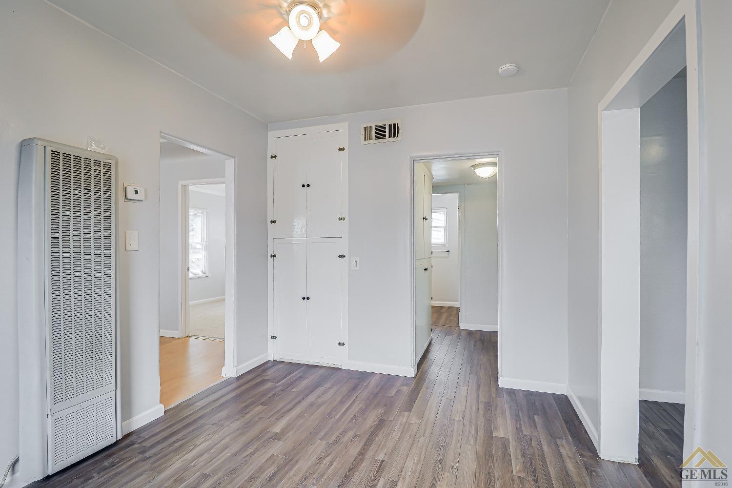 Undisclosed Address Bakersfield, CA 93308 - Photo 17 of 24 a view of a hallway with wooden floor