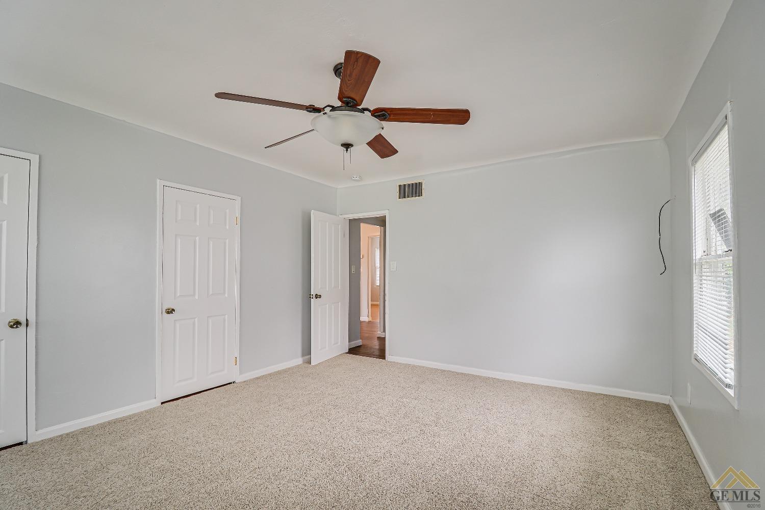 Undisclosed Address Bakersfield, CA 93308 - Photo 21 of 24 a view of room window and a ceiling fan