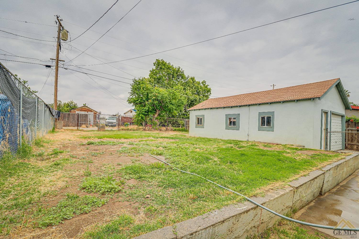 Undisclosed Address Bakersfield, CA 93308 - Photo 23 of 24 a view of a house with a yard