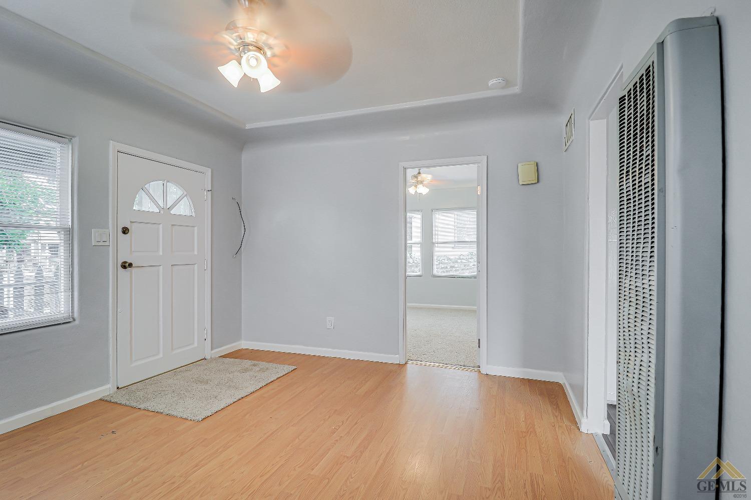 Undisclosed Address Bakersfield, CA 93308 - Photo 4 of 24 wooden floor in an empty room with a window