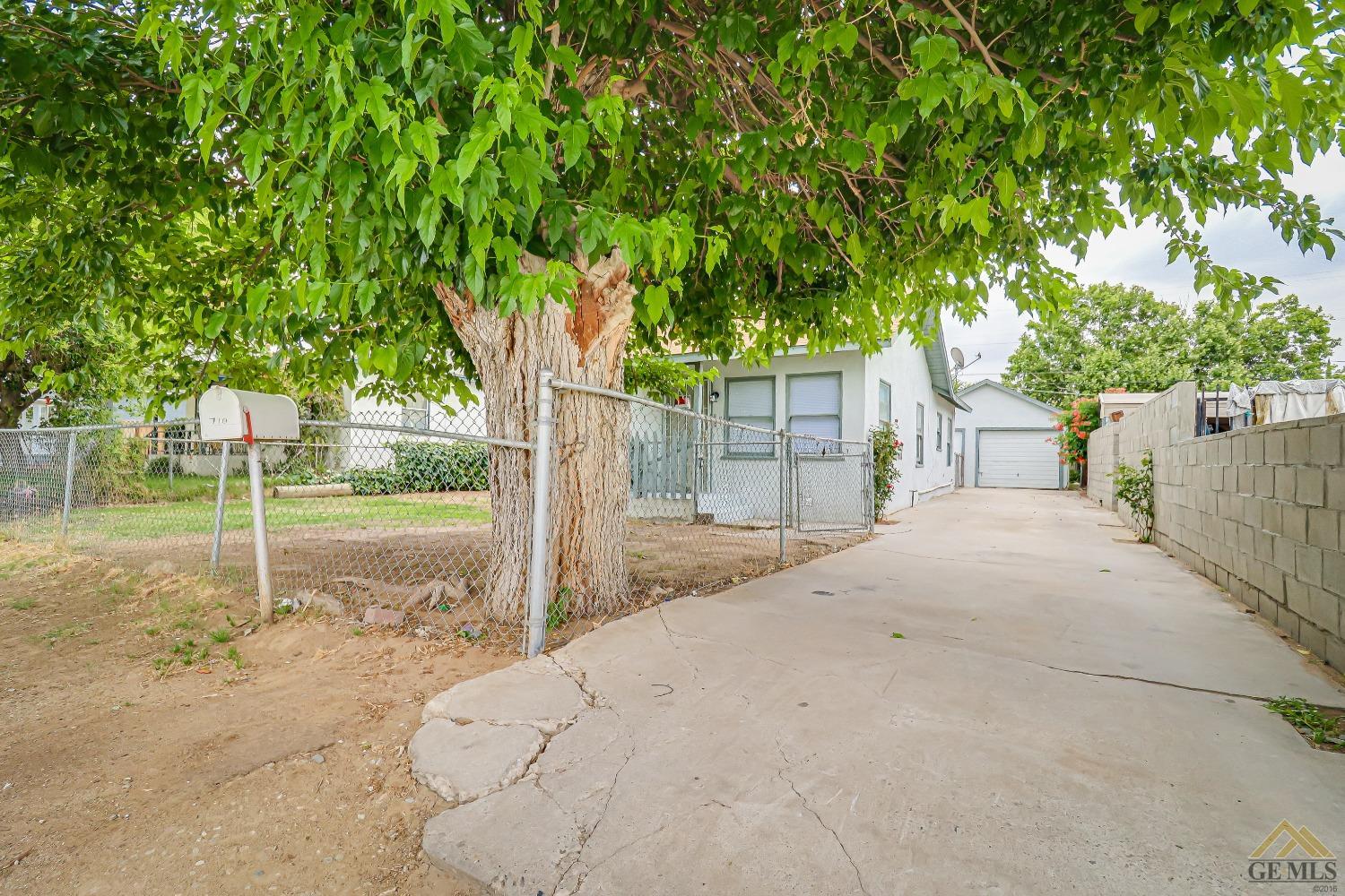 Undisclosed Address Bakersfield, CA 93308 - Photo 7 of 24 a backyard of a house with table and chairs