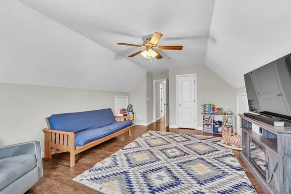 a bedroom with furniture and a chandelier