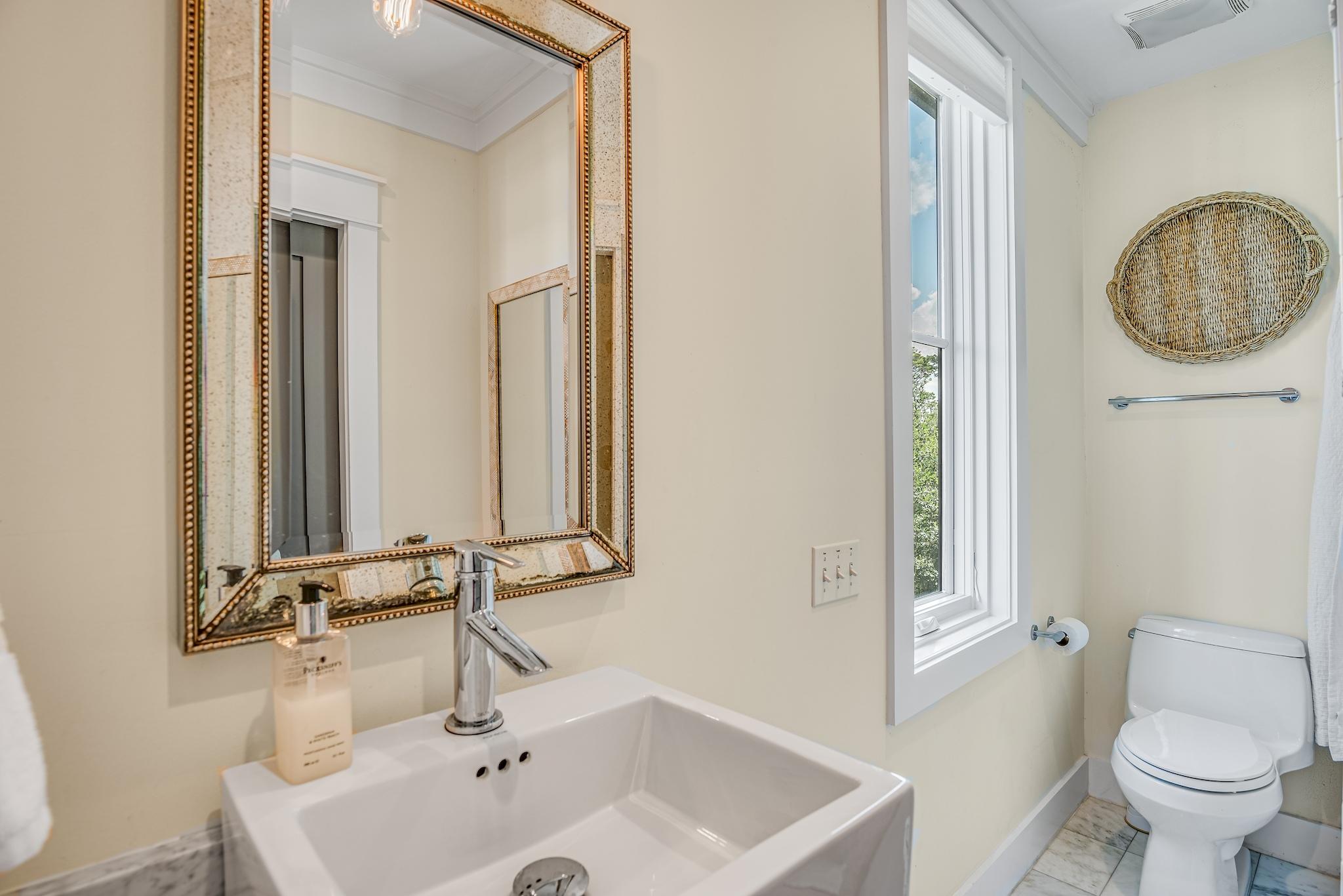76 North Winston Ln Inlet Beach Inlet Beach, FL 32461 - Photo 19 of 48 a bathroom with a sink a toilet and a mirror