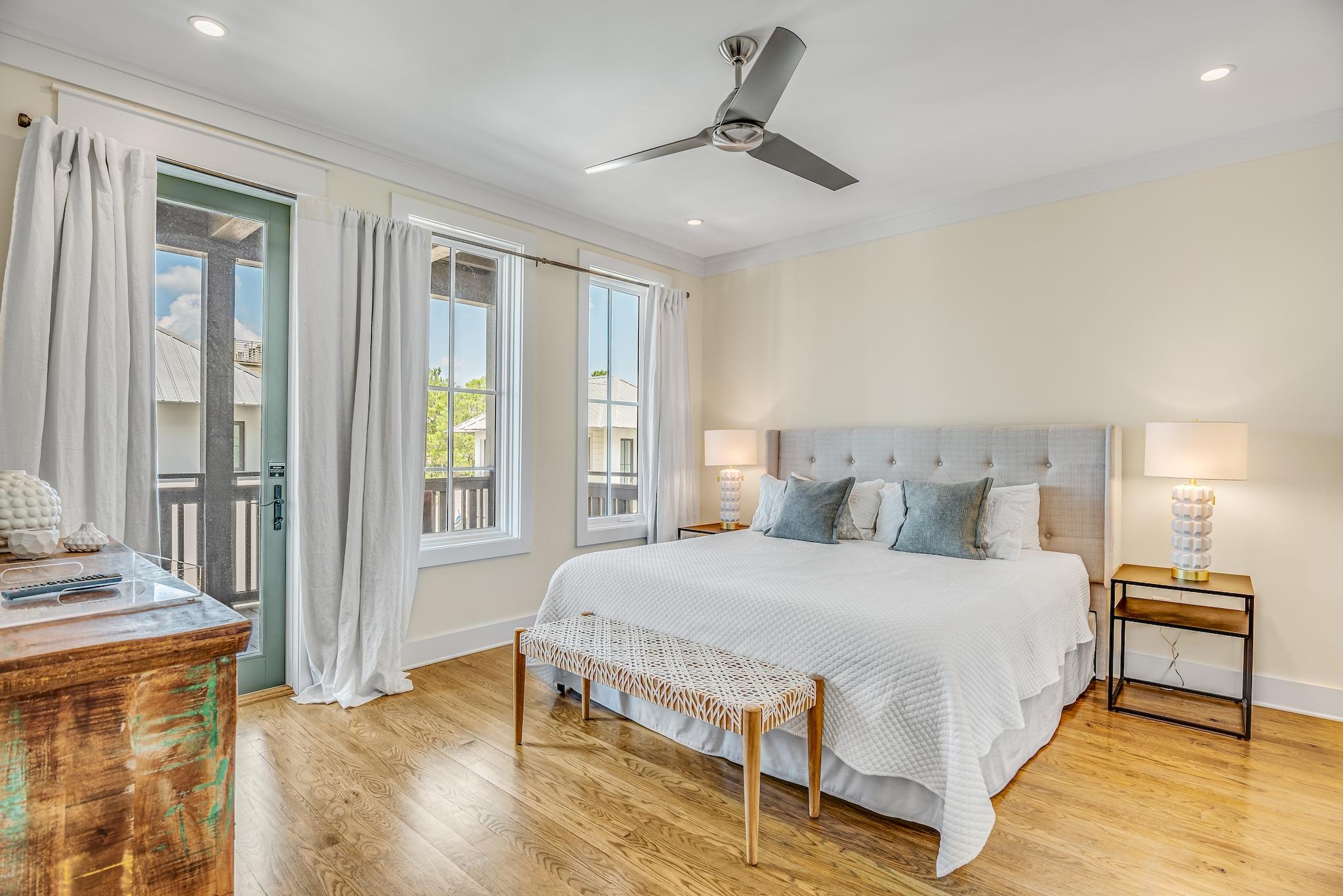 76 North Winston Ln Inlet Beach Inlet Beach, FL 32461 - Photo 20 of 48 a bedroom with a bed a fireplace and a large window