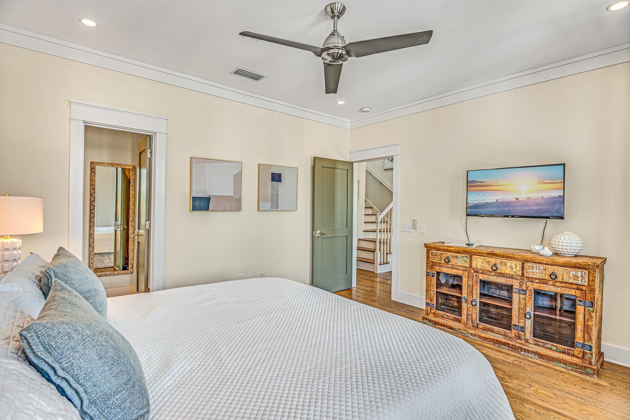 76 North Winston Ln Inlet Beach Inlet Beach, FL 32461 - Photo 21 of 48 a bedroom with a bed and a flat screen tv