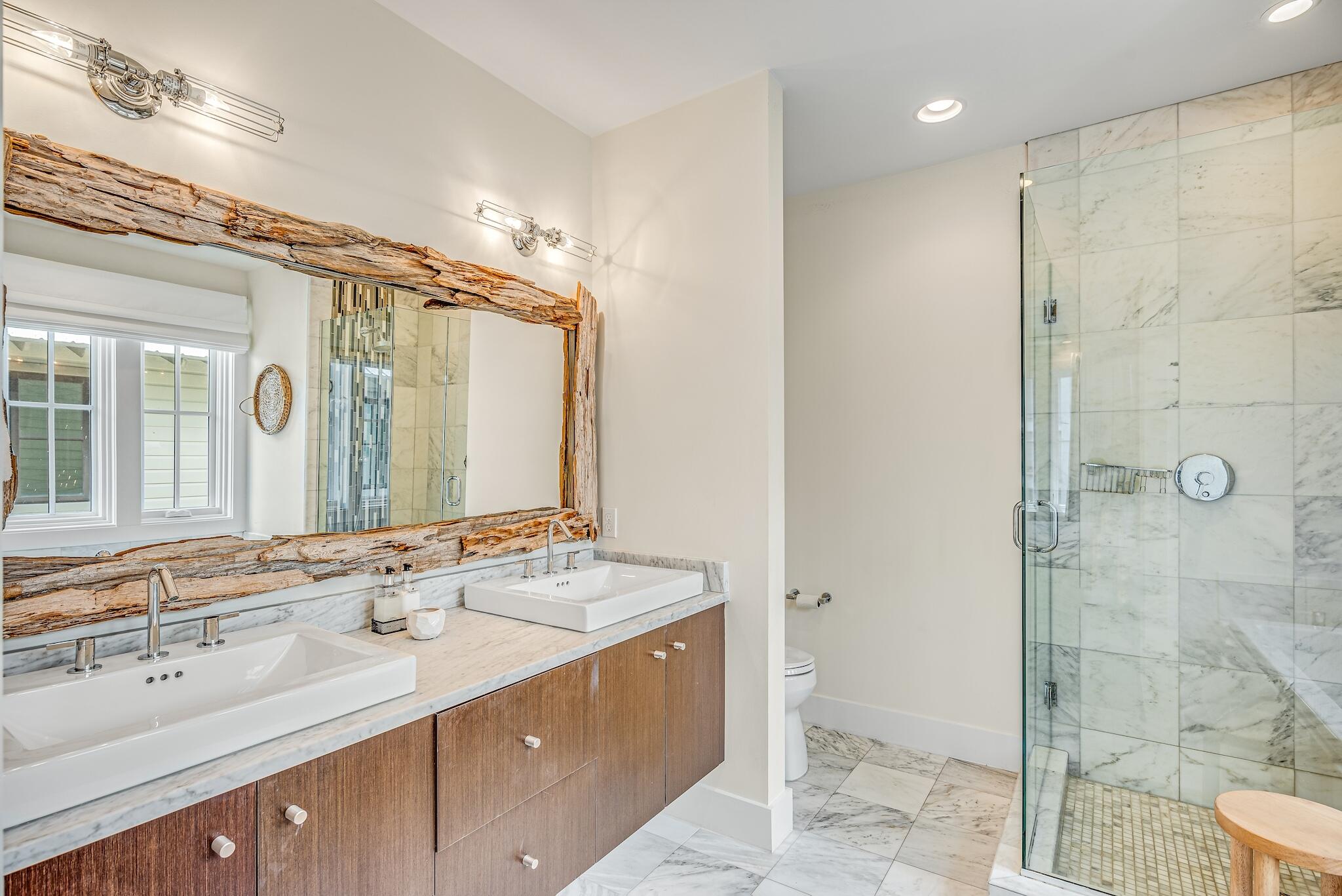 76 North Winston Ln Inlet Beach Inlet Beach, FL 32461 - Photo 25 of 48 a bathroom with a double vanity sink mirror and shower