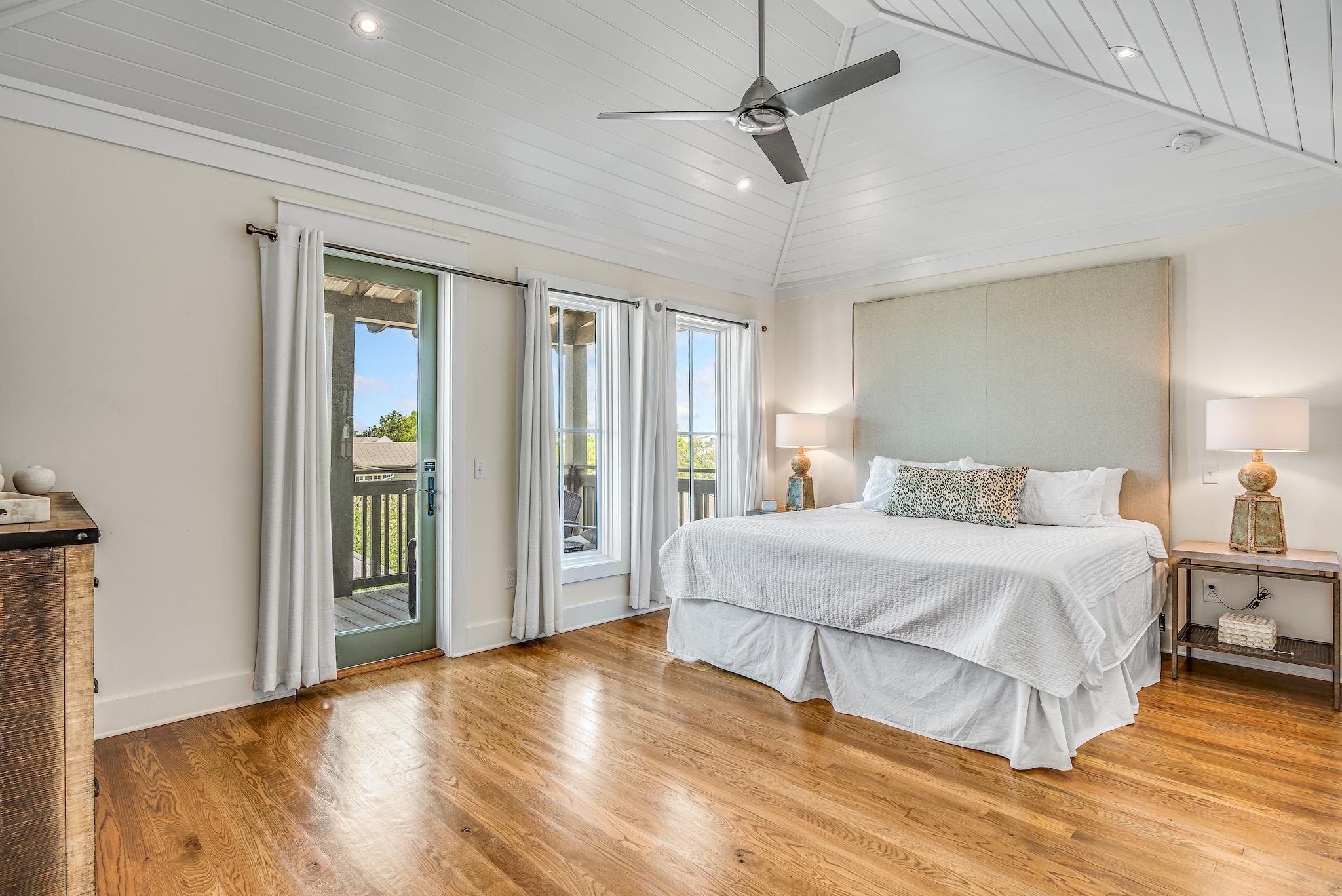 76 North Winston Ln Inlet Beach Inlet Beach, FL 32461 - Photo 27 of 48 a spacious bedroom with a bed and wooden floor