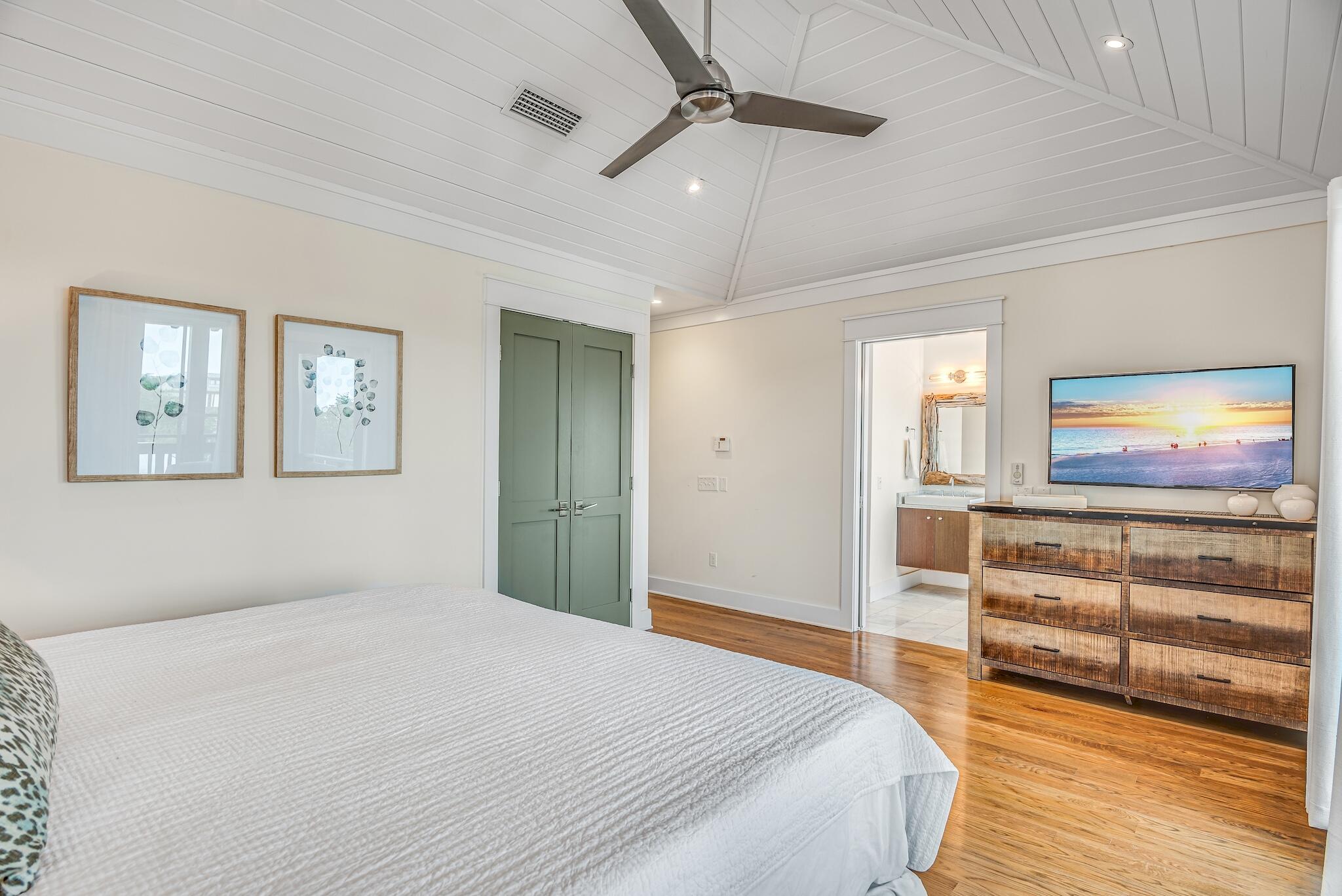 76 North Winston Ln Inlet Beach Inlet Beach, FL 32461 - Photo 28 of 48 a bedroom with a bed and a flat screen tv