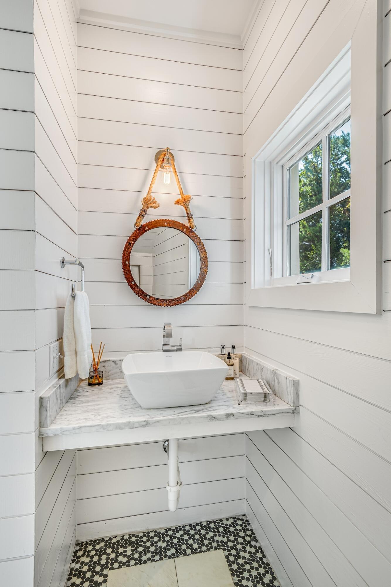 76 North Winston Ln Inlet Beach Inlet Beach, FL 32461 - Photo 10 of 48 a bathroom with a sink and a mirror