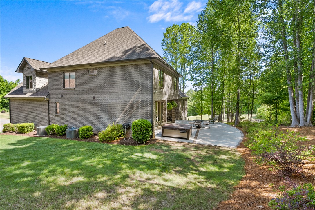 140 Turnberry Road Anderson, SC 29621 - Photo 32 of 44 This spacious property features a lovely outdoor patio with a hot tub, perfect for relaxation.