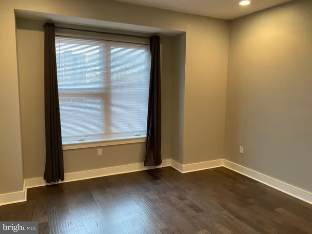 a view of cabinets and wooden floor