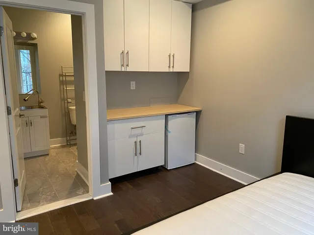 a bathroom with a toilet and a bathtub